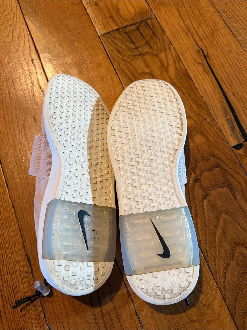Nike Men’s Slip-On Training Shoes in Pale Pink with Black Swoosh